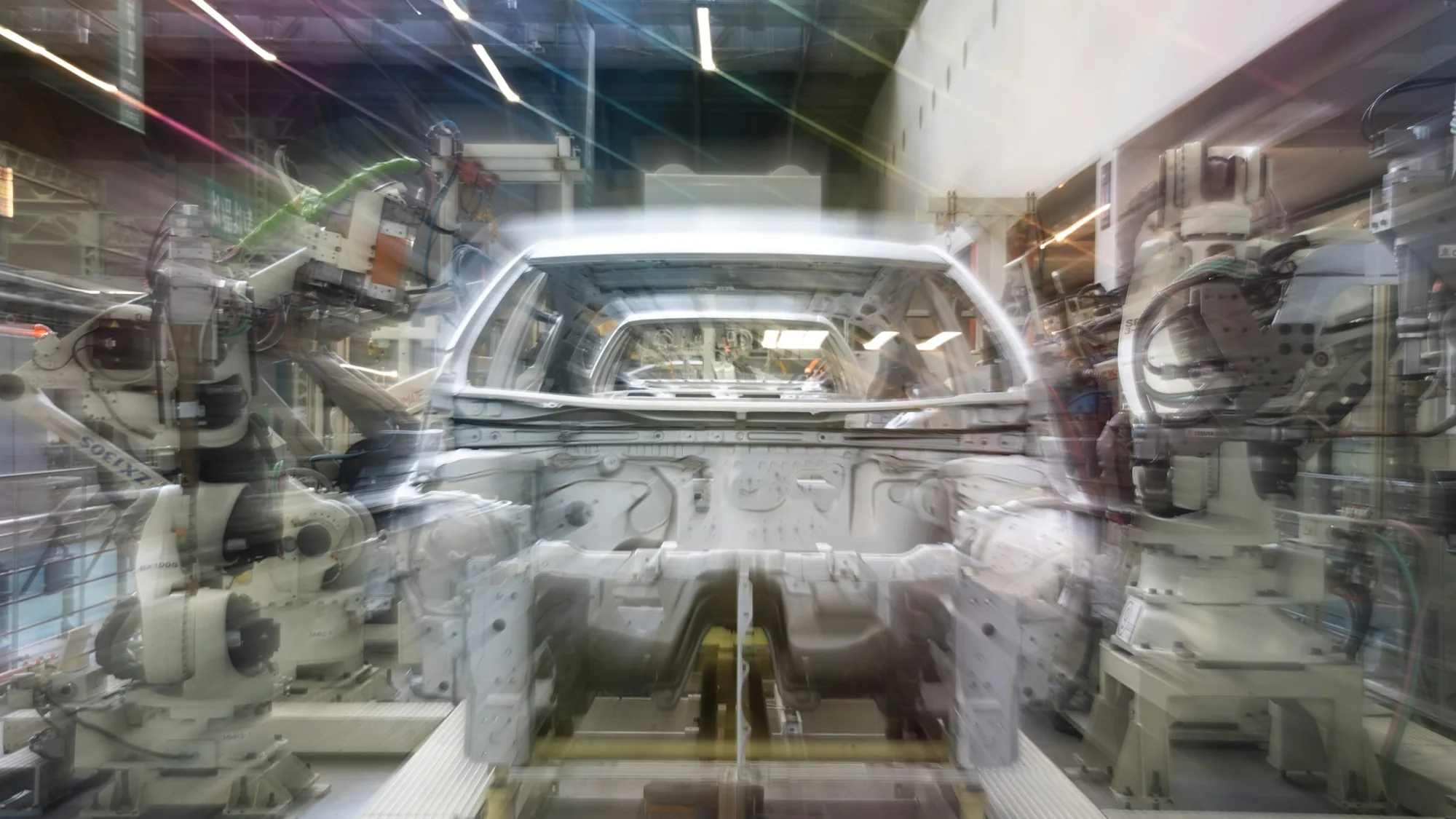 Automated production line with robotic arms in a modern manufacturing facility